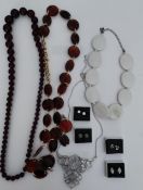 Boxed Diamante and silver plated earrings together with various beaded necklaces.