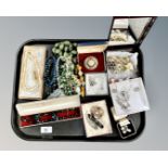 A tray of mixed costume jewellery including Scottish hard stone brooches, bead necklaces,