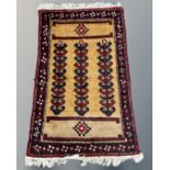 A Caucasian rug, 64cm by 103cm.