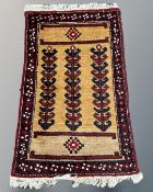 A Caucasian rug, 64cm by 103cm.