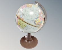A mid century desk globe on stand