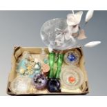 A box containing assorted glassware including paperweights, ornate vases, bowls,