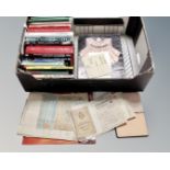 A box containing paper ephemera including programmes, receipts, an early 20th century sketchbook,