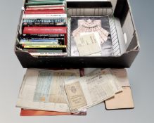 A box containing paper ephemera including programmes, receipts, an early 20th century sketchbook,