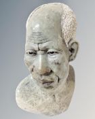 A carved marble bust of a gentleman.