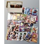 A box containing approximately 200 late 20th to early 21st century comics including Team 7,