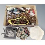 A tray containing a quantity of assorted costume jewellery, beaded necklaces,