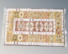 A Turkish woollen rug, 137cm by 85cm.