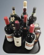 A tray containing nine bottles of alcohol including Disaronno, Tia Maria, port, wine etc.