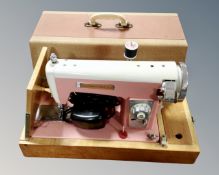 A vintage Seamstress electric sewing machine.