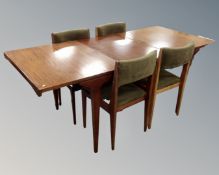 A mid 20th century Everest teak extending dining table and four upholstered chairs