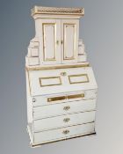 A 19th century Biedermeier style bureau bookcase painted white and gold