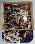 A tray containing a large quantity of costume jewellery including bracelets and necklaces.