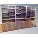 A 20th century Scandinavian rosewood veneered modular three piece bookcase.