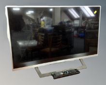A Sony flat panel TV model KDL-32WD752, with remote. CONDITION REPORT: No lead.