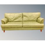 A late 20th century green leather upholstered three seater settee (length 202cm),