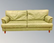 A late 20th century green leather upholstered three seater settee (length 202cm),