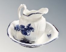 A 19th century blue and white rose patterned wash jug and basin.