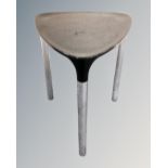 A Gedy Yannis tripod stool on chrome legs.