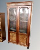 A 19th century mahogany and walnut double door glazed bookcase