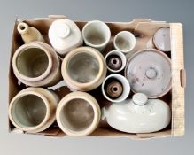 A box containing vintage stoneware kitchen storage jars, water bottles, ginger beer bottle.