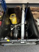 A large plastic crate containing assorted power tools, 110v transformer, hand tools,