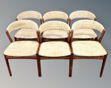 A set of six 20th century teak framed elbow chairs.