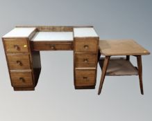 A mid 20th century oak dressing table (no mirror) and an occasional table