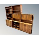 A Scandinavian rosewood three section bookcase fitted with cupboards and drawers.
