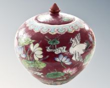 A Chinese pumpkin vase with lid.