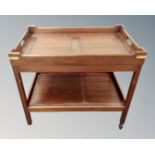 A mahogany serving trolley with lift off top.