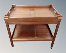A mahogany serving trolley with lift off top.