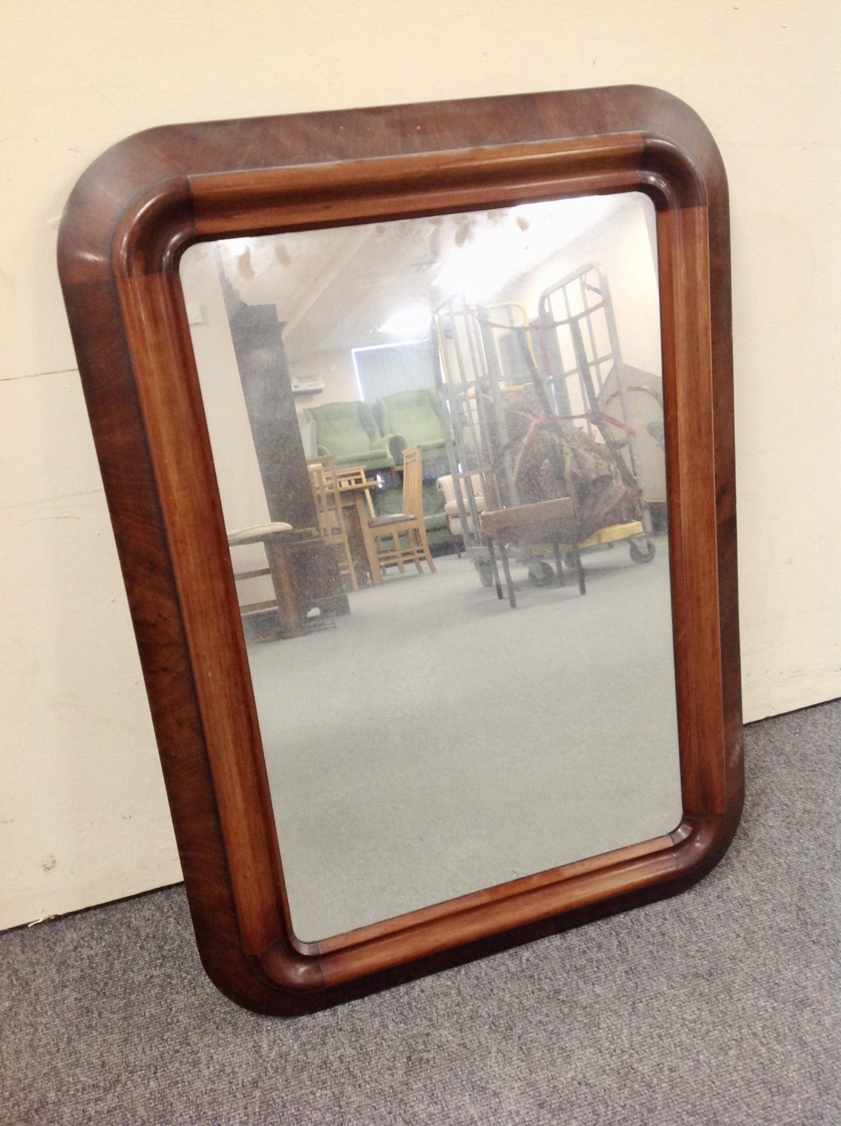 A 19th century mahogany framed cushion mirror, 79cm by 57cm.