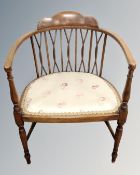 An Edwardian beech open armchair
