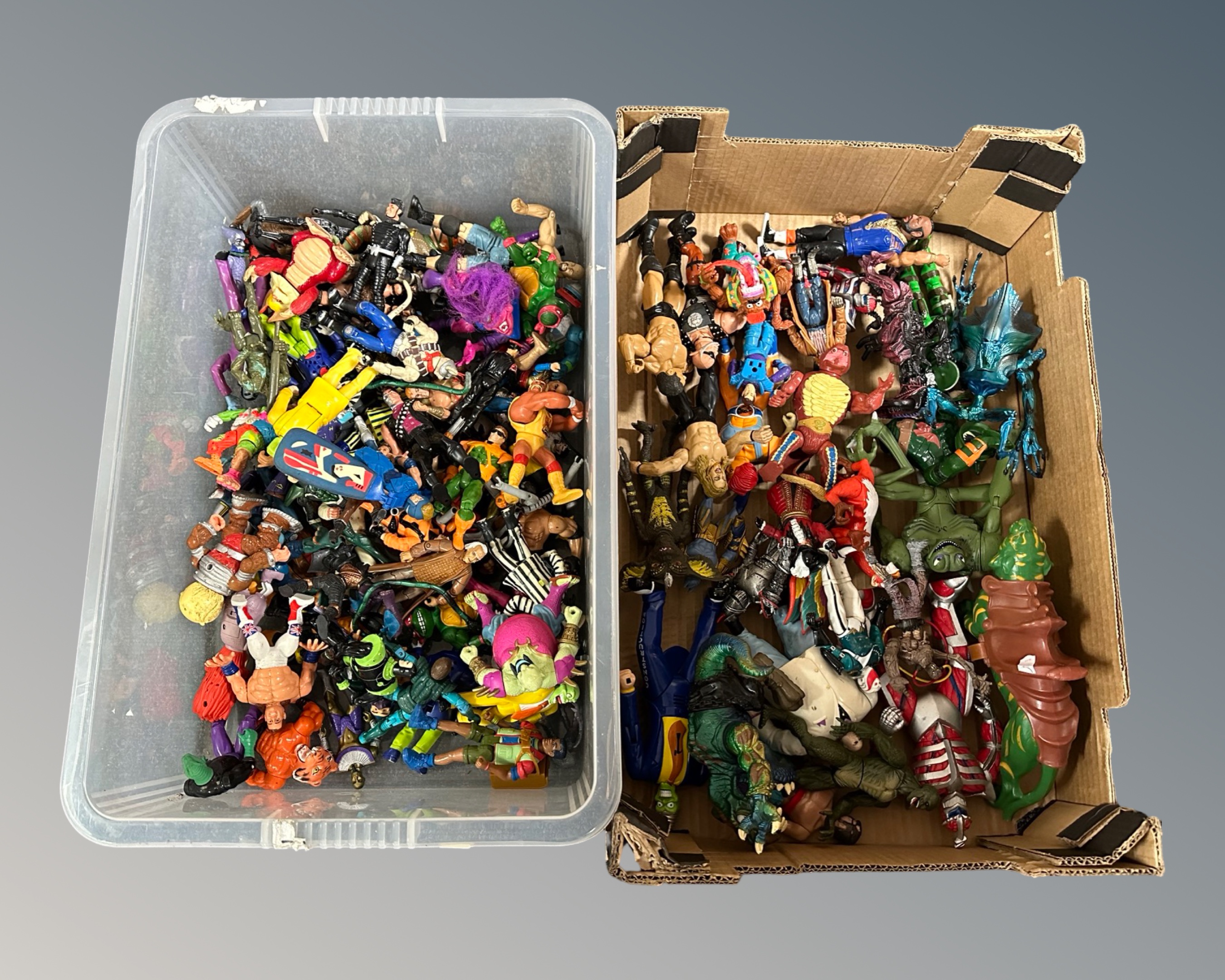 Two boxes containing a quantity of 1980s and later action figures including He-Man, turtles,