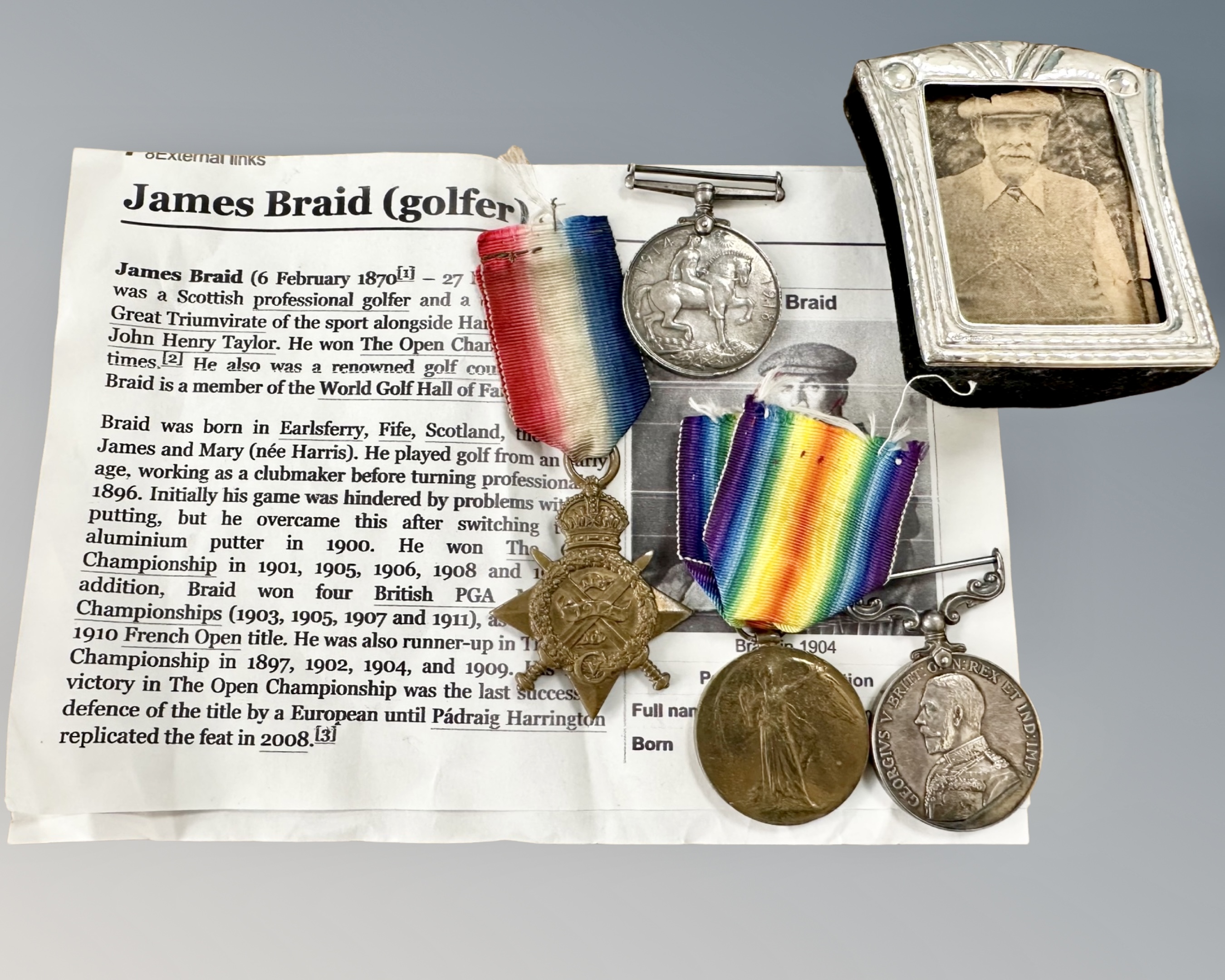 A group of medals comprising a 1914 Star entitled to one bar,