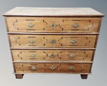 A 19th century inlaid oak chest of four drawers.
