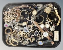 A tray of costume jewellery, bangles, wristwatches etc.
