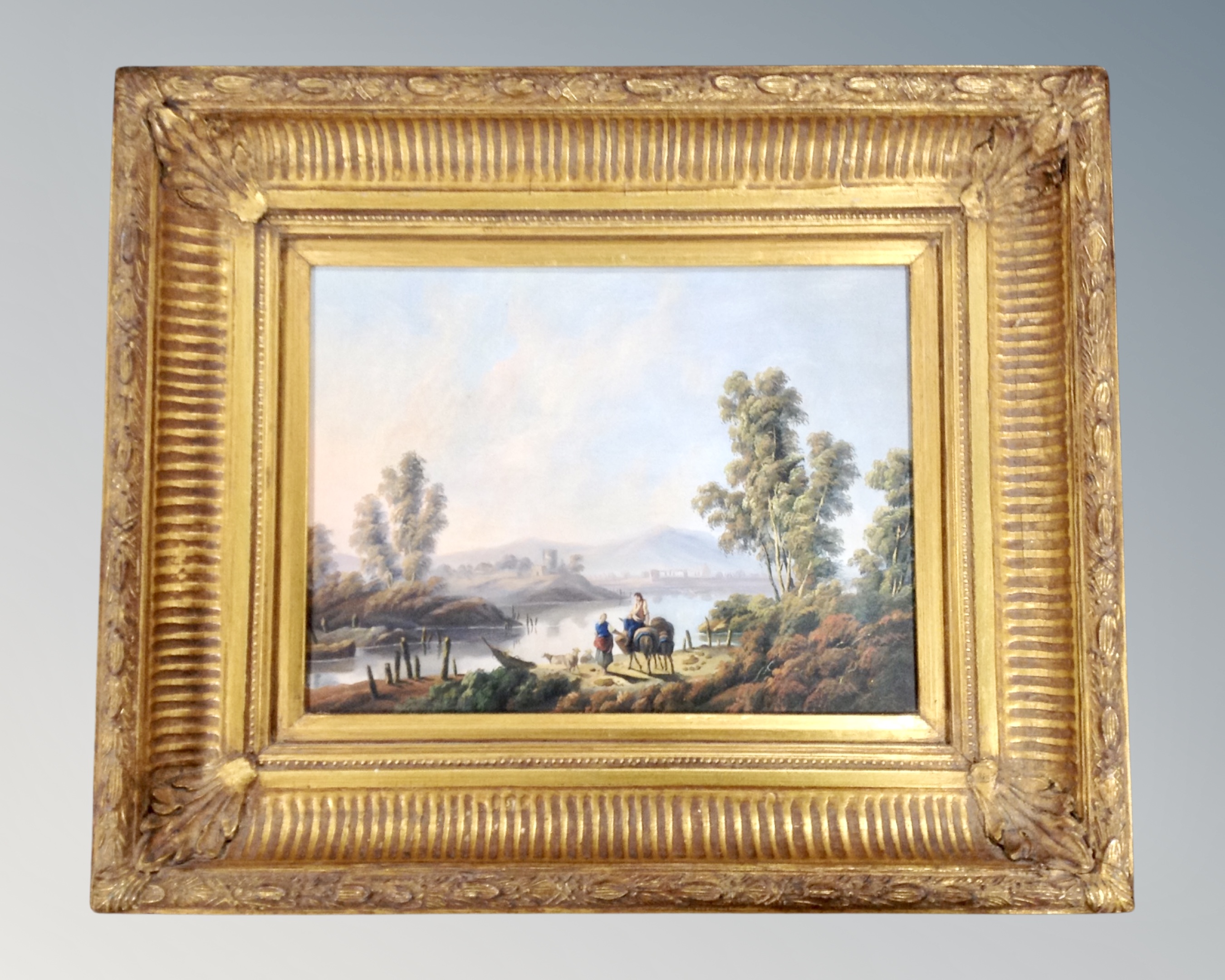 Contemporary school : Two figures with pack mules by a lake, oil on panel, 39cm by 29cm.