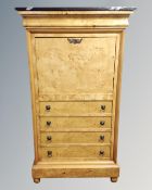 A marble topped satinwood veneered fall front secretaire cabinet fitted with four drawers beneath.