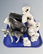 A tray containing two pairs of Staffordshire spaniel figures,