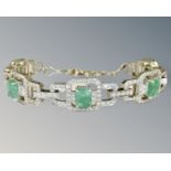 An 18ct white gold emerald and diamond bracelet, about 245 diamonds, in original Mappin & Webb box,