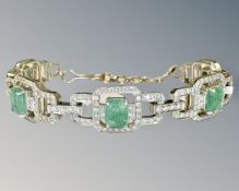 An 18ct white gold emerald and diamond bracelet, about 245 diamonds, in original Mappin & Webb box,