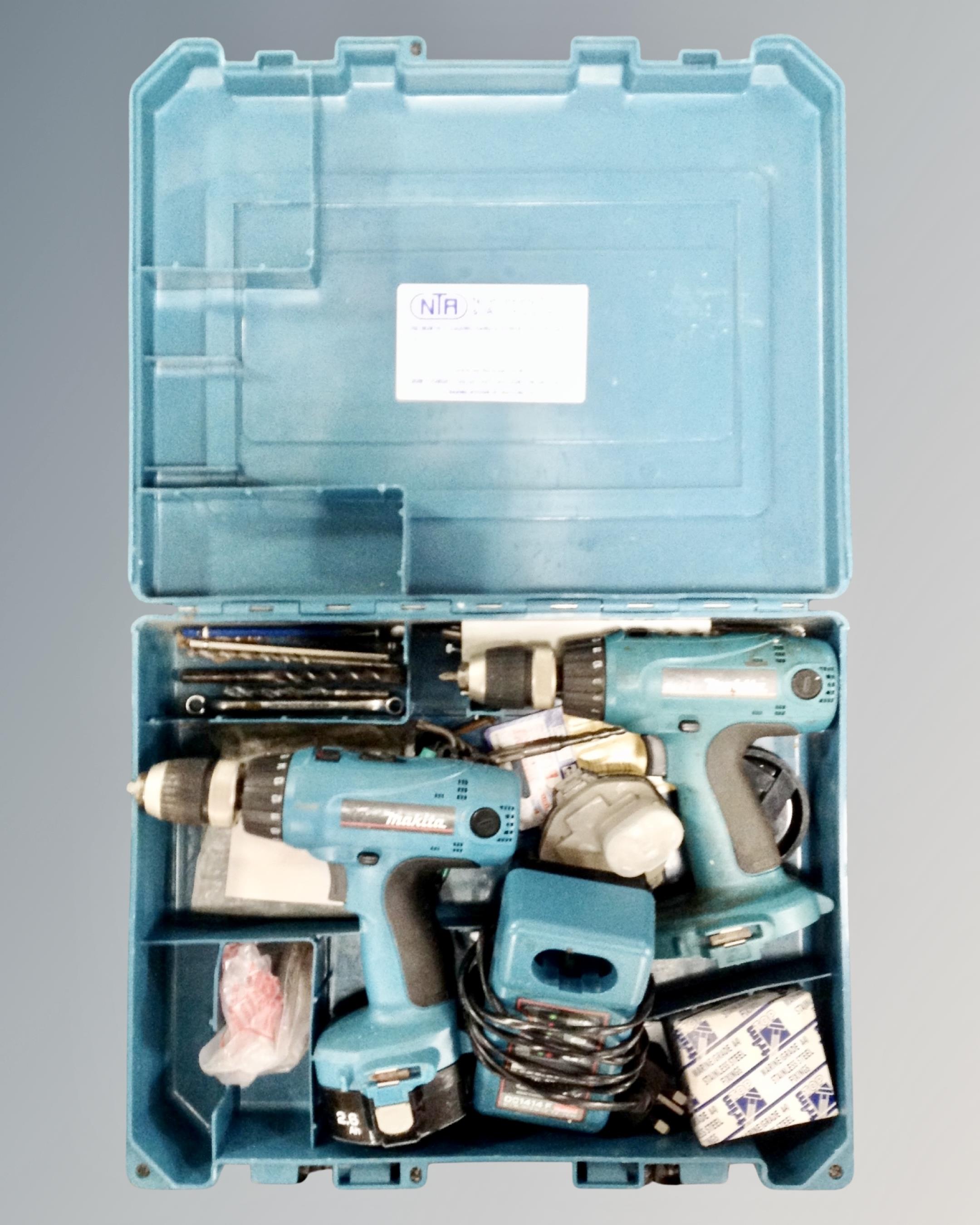 A Makita 14.4v electric drill twin pack, with batteries and charger, cased.