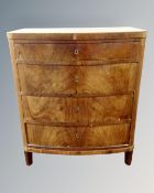 A 19th century Scandinavian mahogany bow front chest of four drawers.