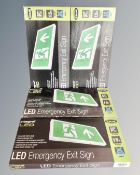 Four Slimline integral LED emergency exit signs, boxed.