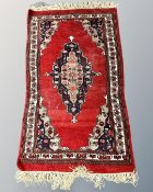 An Iranian Hamadan rug, 66cm by 121cm.