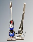 A Dyson DC 24 ball vacuum together with a Morphy Richards cordless electric stick vacuum.