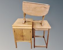 An oak double door gramophone cabinet and two occasional tables