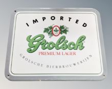 A Grolsch enamelled sign.
